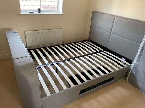 king size bed with side draws and a inbuilt TV